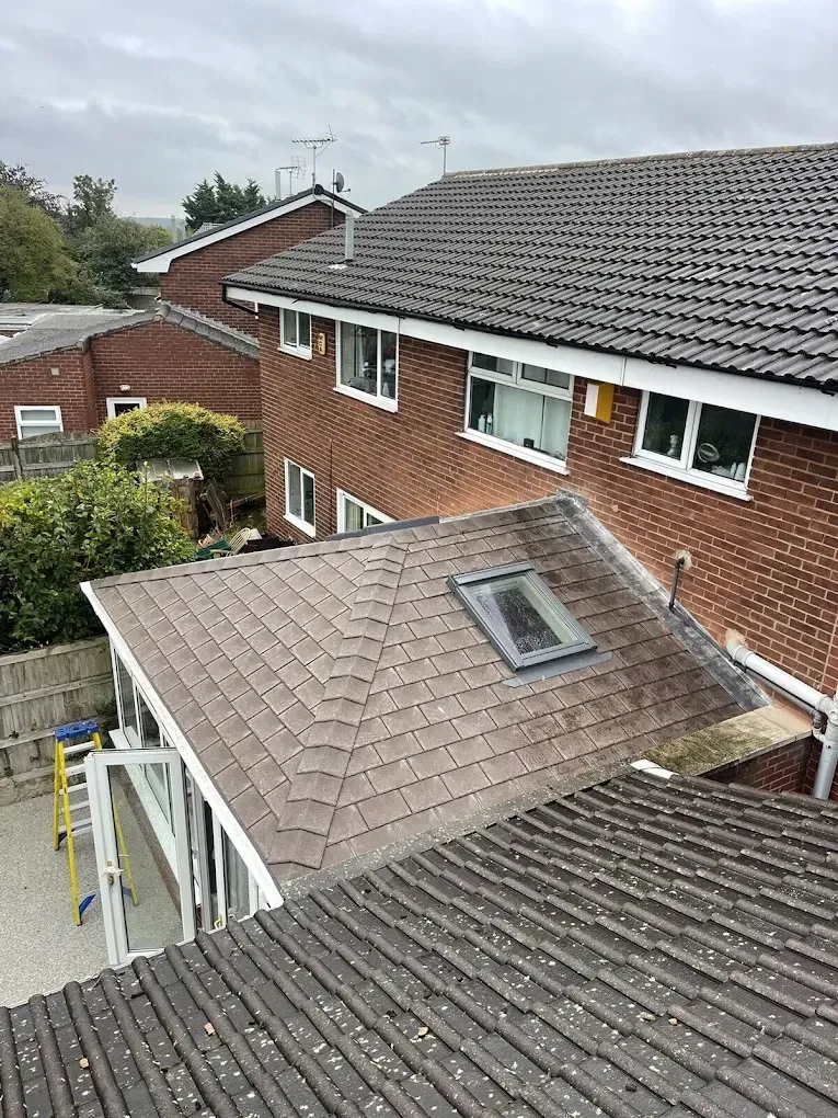 Newly fitted grey tiled conservatory roof with skylight